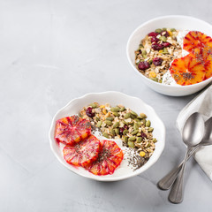 Healthy morning breakfast with granola yogurt blood oranges