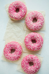 Donut. Sweet icing sugar food. Dessert colorful snack. Glazed sprinkles. Treat from delicious pastry breakfast. Bakery cake. Doughnut with frosting. Baked unhealthy round. Top view