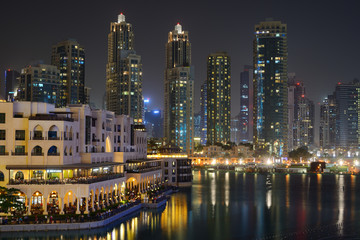 Fototapeta na wymiar Skyscrapers of Dubai Downtown at nignt