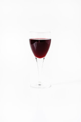 Full glass of red wine, like Merlot, Boredaux or Cabernet sauvignon, or grape juice in wineglass with stem on white background