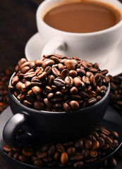 Composition with two cups of coffee and beans