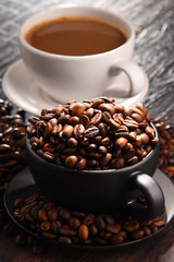 Composition with two cups of coffee and beans