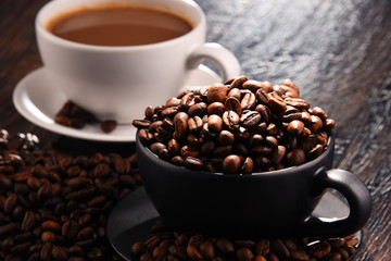 Composition with two cups of coffee and beans