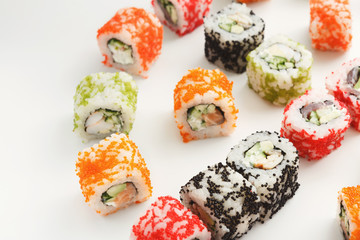 Closeup set of sushi rolls, on white background
