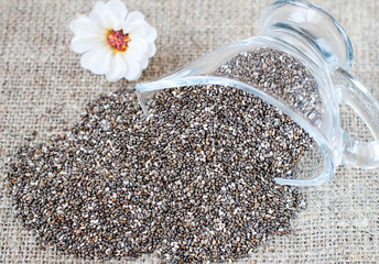 Spilled chia seeds on a linen tablecloth