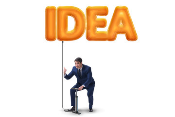 Businessman pumping innovative idea balloon