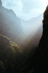 Mysterious light rays on the slopes of the rocks in huge canyon on Santo Antao island, Cape Verde, Cabo Verde