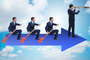 Fototapeta premium Team of businessmen in teamwork concept with boat