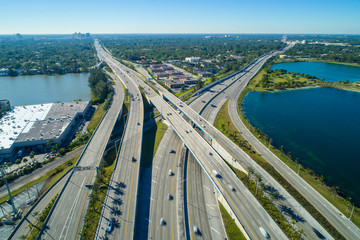 Aerial image highway interchange daytime motion blur cars - obrazy, fototapety, plakaty