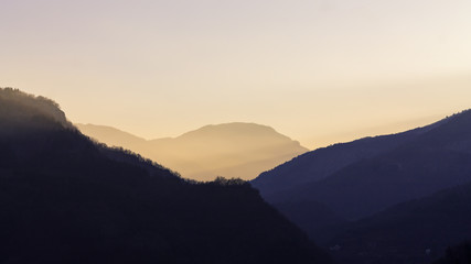 Fototapeta na wymiar A sunset over mountains