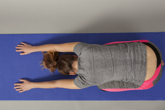 Girl In Yoga Position Sleeping Dog Top View