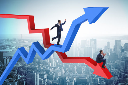 Businessman with charts of growth and decline