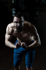 Fototapeta na wymiar Portrait Of A Physically Fit Muscular Nerd Man