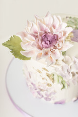 Obraz na płótnie Canvas Artistic Wedding Cake With Edible Dahlia Flower