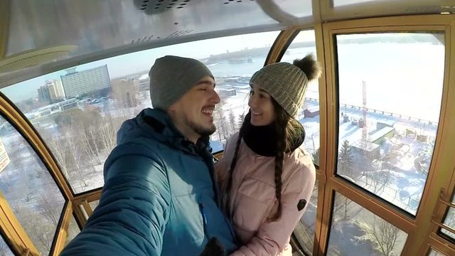 Guy suddenly kissed the girl in cockpit of Ferris wheel and she was surprised.