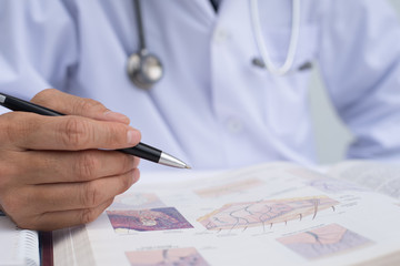 Doctor reading book