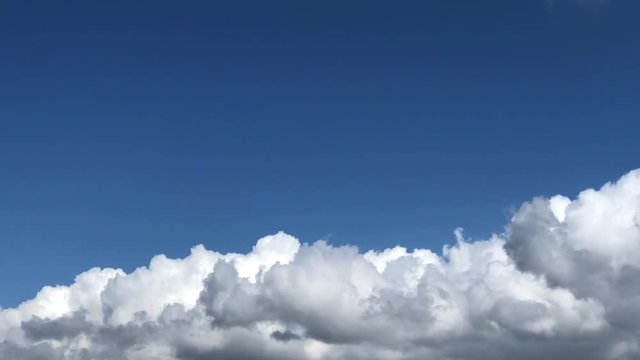 HD Video storm clouds rolling in covering sky previously clear blue. 