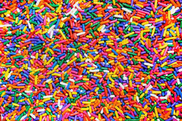 Rainbow sprinkles close up background - Powered by Adobe