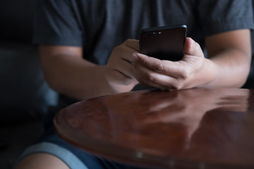 Close-up image using modern smartphone device social and checking email or working networking concept