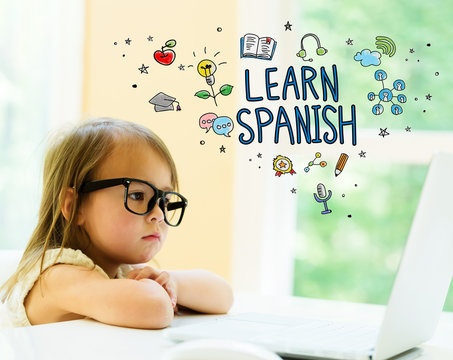 Learn Spanish text with little girl using her laptop