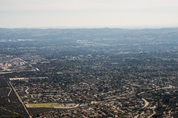 Obraz premium Aerial View of the City of Claremont, Ontario, Upland, Rancho Cucamonga, Montclair, and Pomona from Potato Mountain, Mount Baldy, California