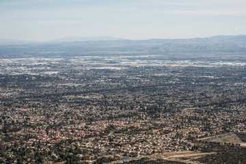 Obraz premium Aerial View of the City of Claremont, Ontario, Upland, Rancho Cucamonga, Montclair, and Pomona from Potato Mountain, Mount Baldy, California