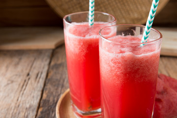 Watermelon smoothie on wood background