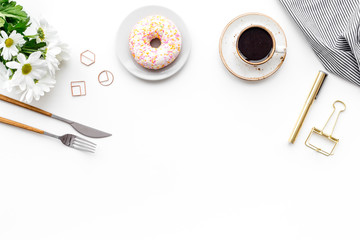 Romantic breakfast with flowers on the table. Coffee with dessert on white background top view copy space