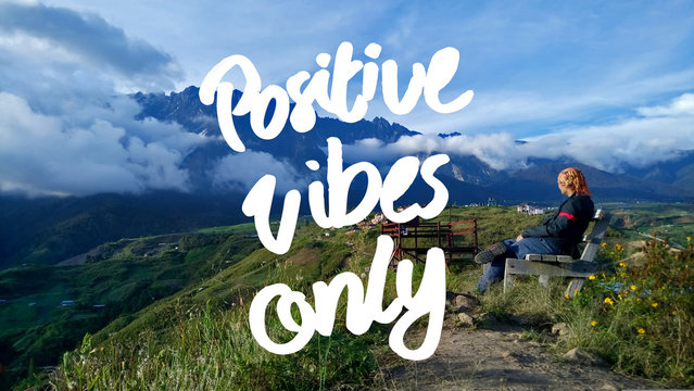 Positive Vibes Only quote against landscape view on sunny day. selected focus.