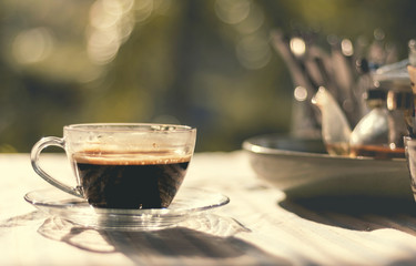 Cup of coffee on table in coffee shop 
