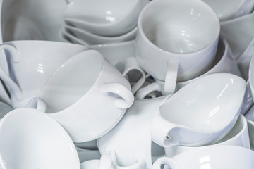 Group of soup cup white ceramics dish, plate, stacked together in the kitchen for food and beverage catering