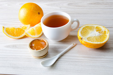 Cup of tea served with orange jam