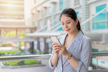 young businesswoman texting message