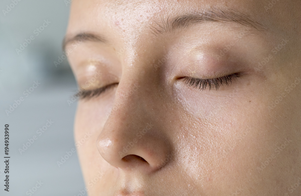 Wall mural Closeup portrait of white woman eyes closed