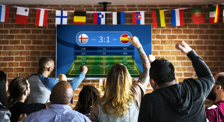 Frieds cheering sport at bar together