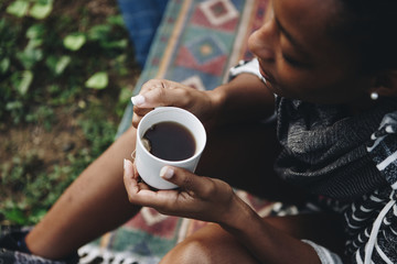 Woman enjoying morning coffee with nature