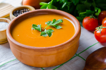 Pumpkin soup served on the table in bowl