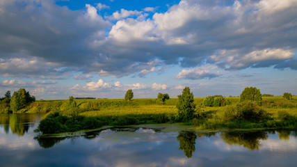 Fototapeta na wymiar beautiful summer landscape of the river and forest. blue sky with clouds. Western Siberia, Russia