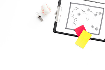 Sport judging concept. Soccer referee. Tactic plan for game, ball, red and yellow cards, whistle on white background top view copy space