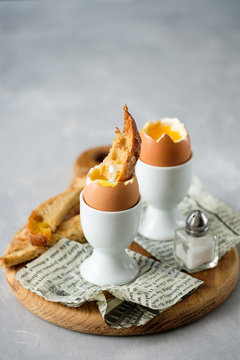 Soft boiled chicken egg for breakfast, with toast.