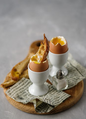 Soft boiled chicken egg for breakfast, with toast.