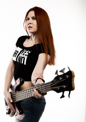 rock woman playing on electric guitar on a white background.