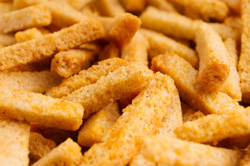 Wheat croutons sticks closeup as background.