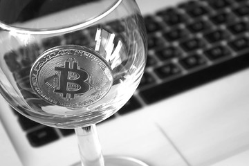 bitcoin in a cocktail glass close-up