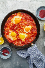 Overhead image of traditional jewish and middle eastern food: shakshuka. Israeli cuisine concept