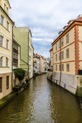 Fototapeta na wymiar Old quarter on a tributary of the Vltava river