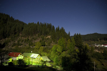 night scene in the village with stars and blue sky