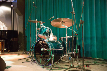 Fototapeta na wymiar Variety drum set on the scene of a night club