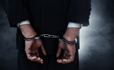 Businessman in handcuffs