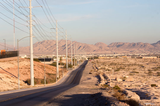 Paved Desert Road Near Mountains 
